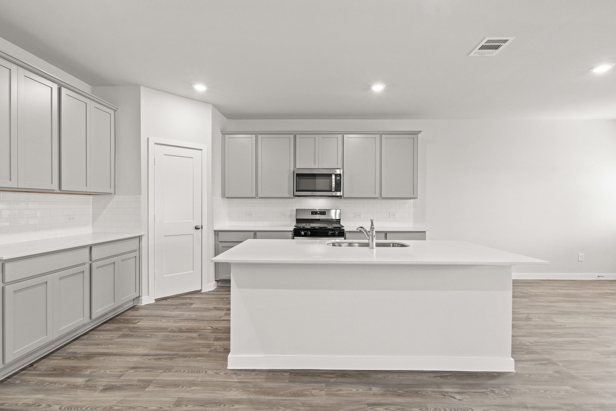 117 Bayou Bend Angleton, TX 77515 - Photo 3 of 28 a kitchen with stainless steel appliances granite countertop a white stove top oven and white cabinets