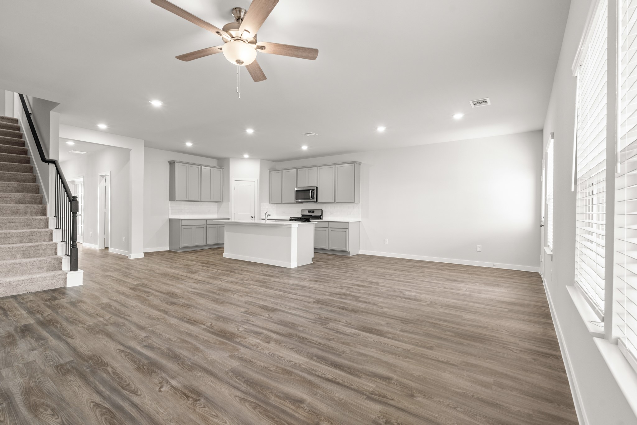 117 Bayou Bend Angleton, TX 77515 - Photo 5 of 28 a view of kitchen with refrigerator stove microwave and cabinets