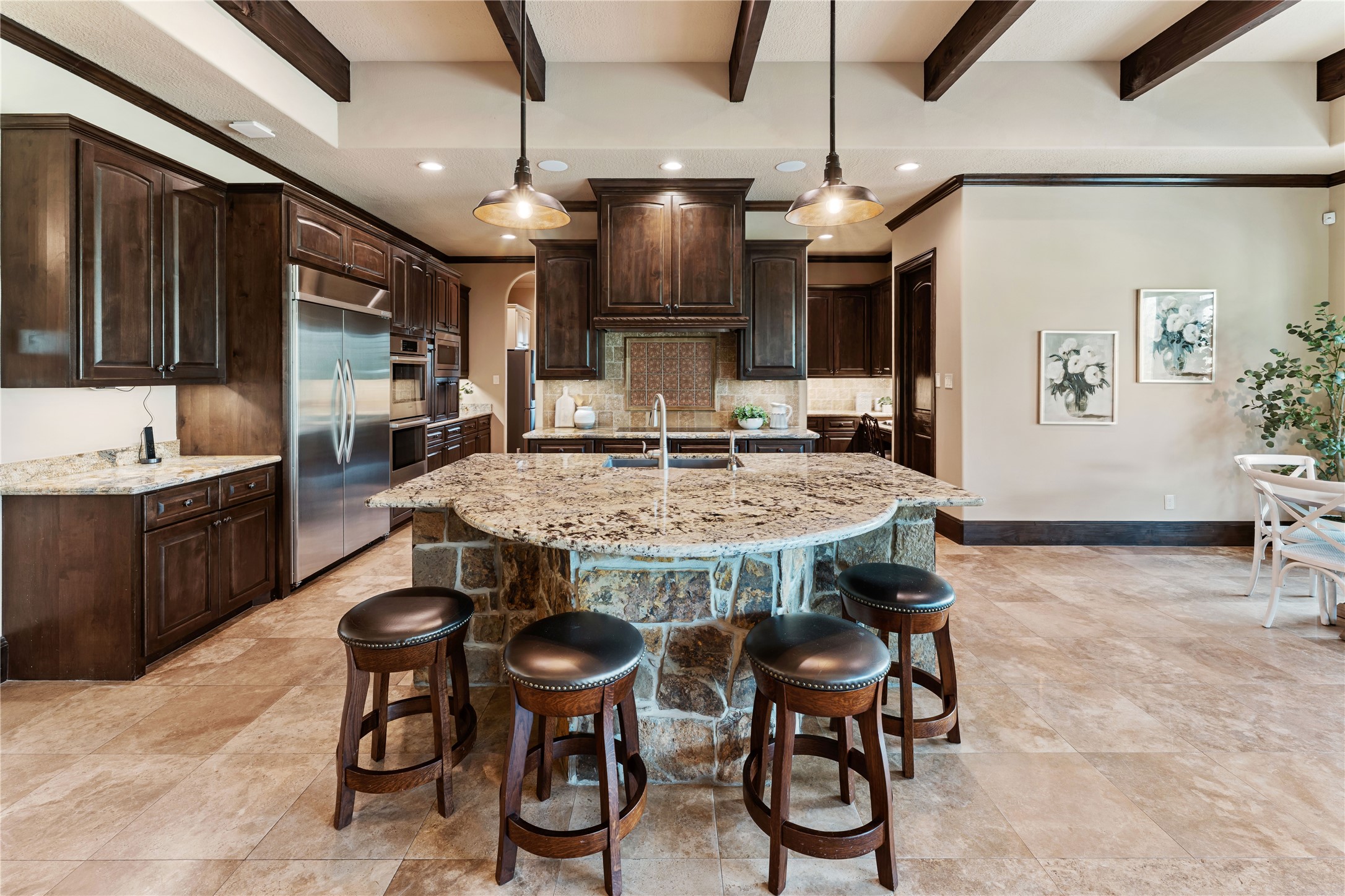 4727 Sugar Maple Court Fulshear, TX 77441 - Photo 10 of 50 The large uniquely shaped, granite-topped stone island is perfect for families and
entertaining.