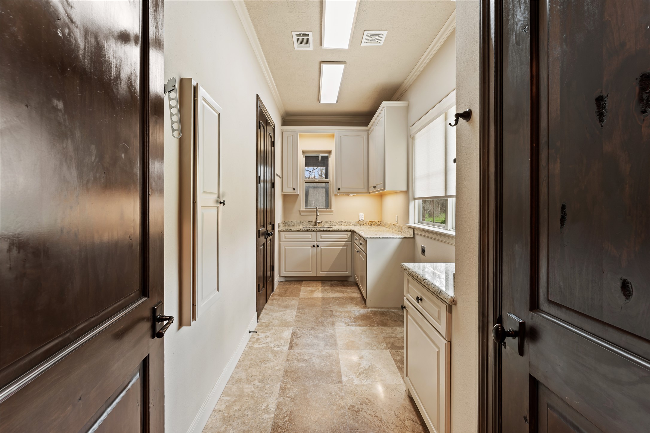 4727 Sugar Maple Court Fulshear, TX 77441 - Photo 28 of 50 Main laundry room adjacent to primary closet with large window providing a beautiful view to
front yard and lots of natural light.