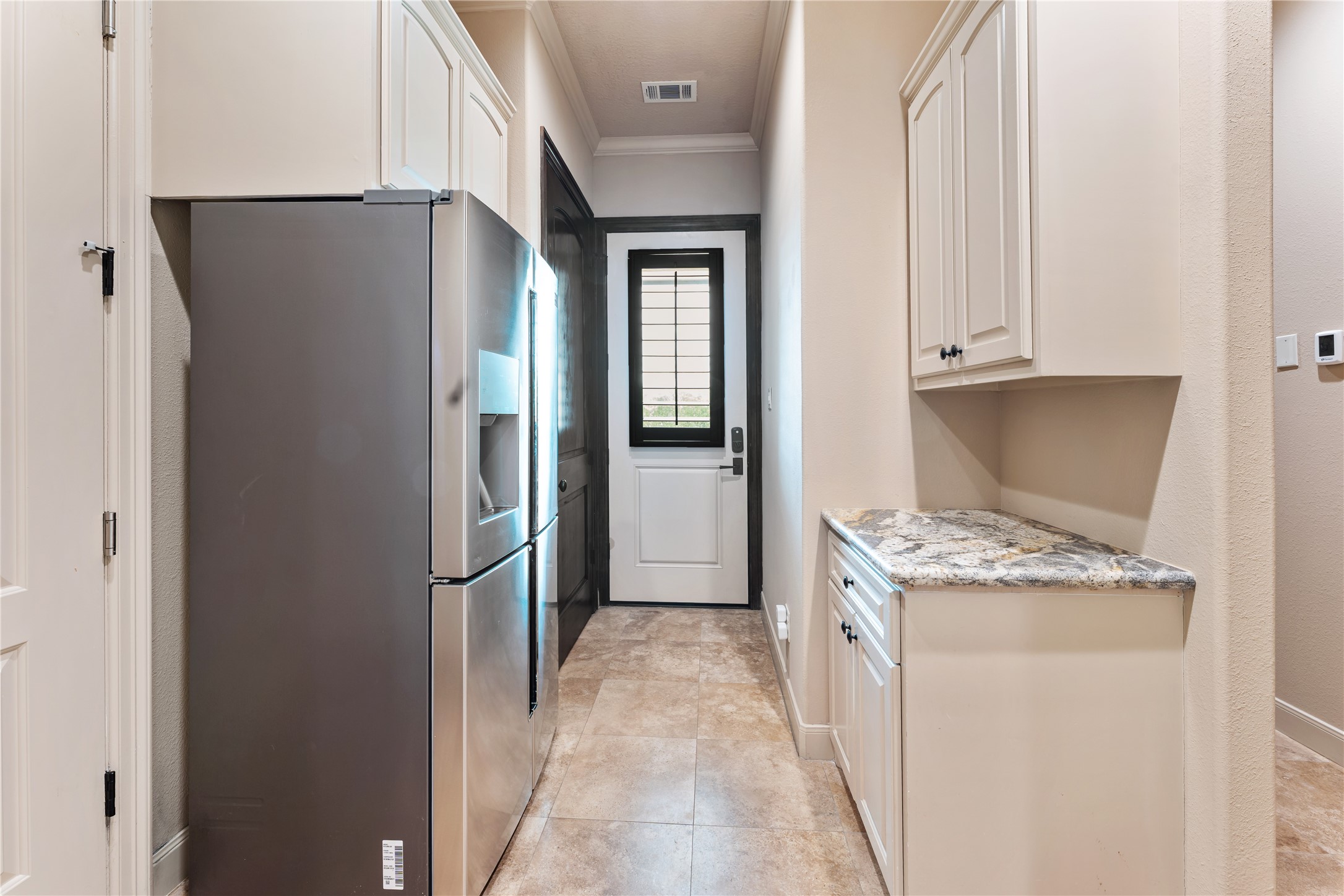 4727 Sugar Maple Court Fulshear, TX 77441 - Photo 29 of 50 a kitchen with stainless steel appliances granite countertop a refrigerator and a sink