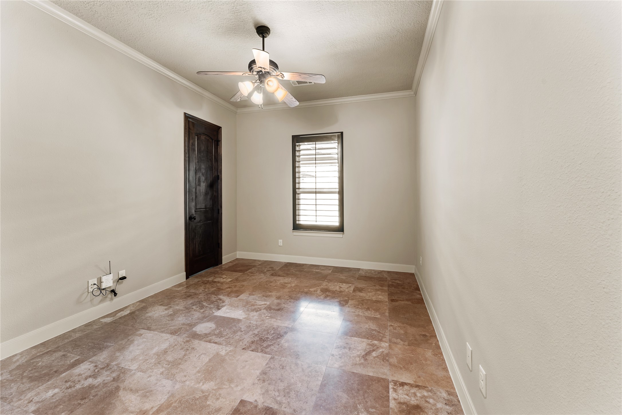 4727 Sugar Maple Court Fulshear, TX 77441 - Photo 32 of 50 Additional secondary bedroom with ceiling fan and travertine floors.