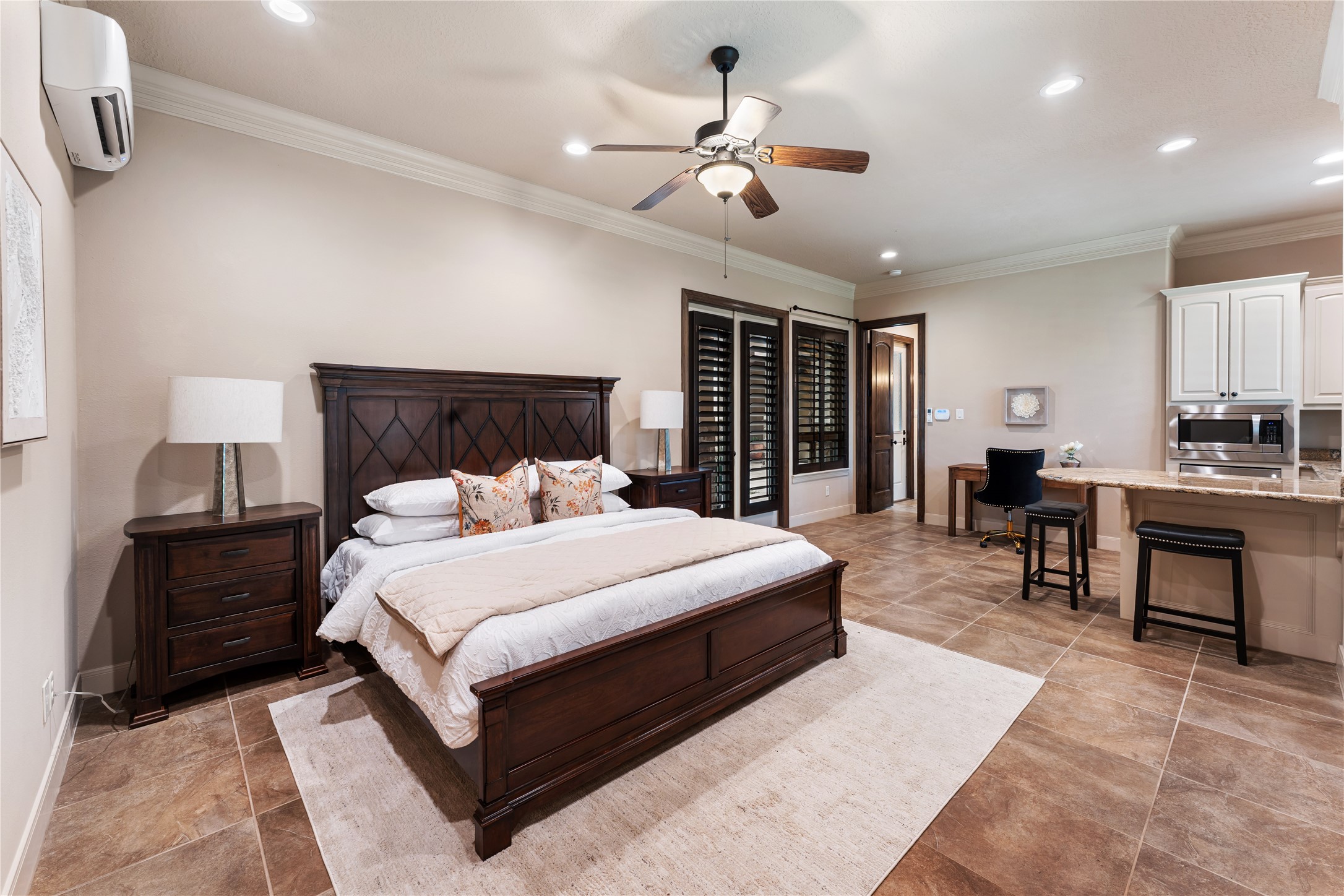 4727 Sugar Maple Court Fulshear, TX 77441 - Photo 34 of 50 Casita apartment with efficiency kitchen set up as a guest area across the front courtyard
from the main house.