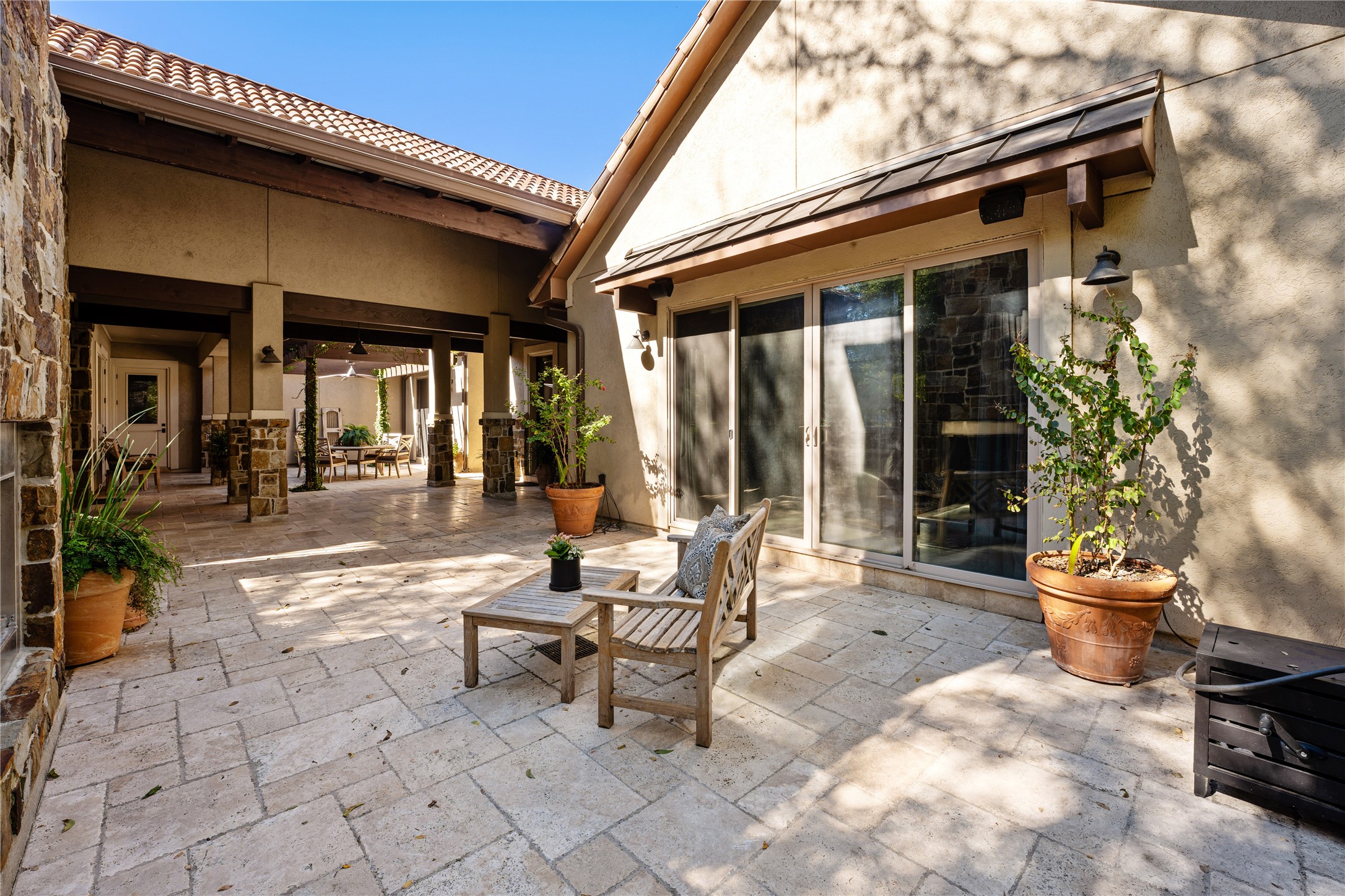 4727 Sugar Maple Court Fulshear, TX 77441 - Photo 3 of 50 a view of a patio with table and chairs and potted plants