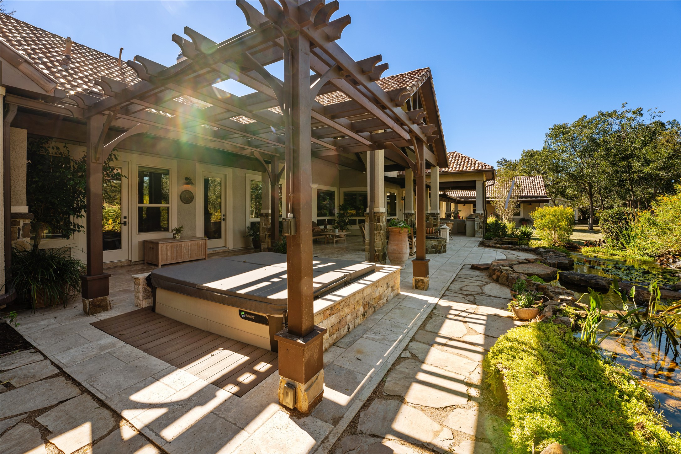 4727 Sugar Maple Court Fulshear, TX 77441 - Photo 40 of 50 Relax after a long day in this luxurious 7 person Hot Spring Grandee hot tub with solid wood
12’ x 12’ pergola added in 2020.