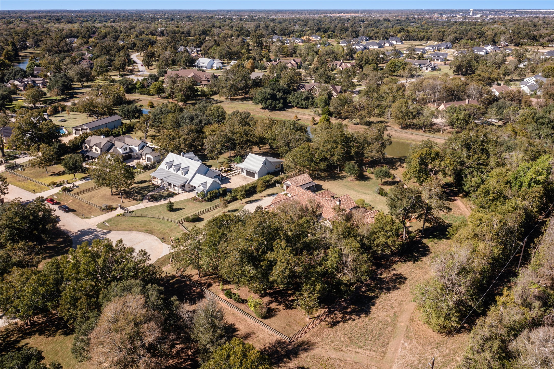 4727 Sugar Maple Court Fulshear, TX 77441 - Photo 45 of 50 Ariel view of the property from the east with White Ibis Pond in the greenbelt to the north
(back) of the property and the White Ibis walking trail in the greenbelt to the east (right) of the
property.
