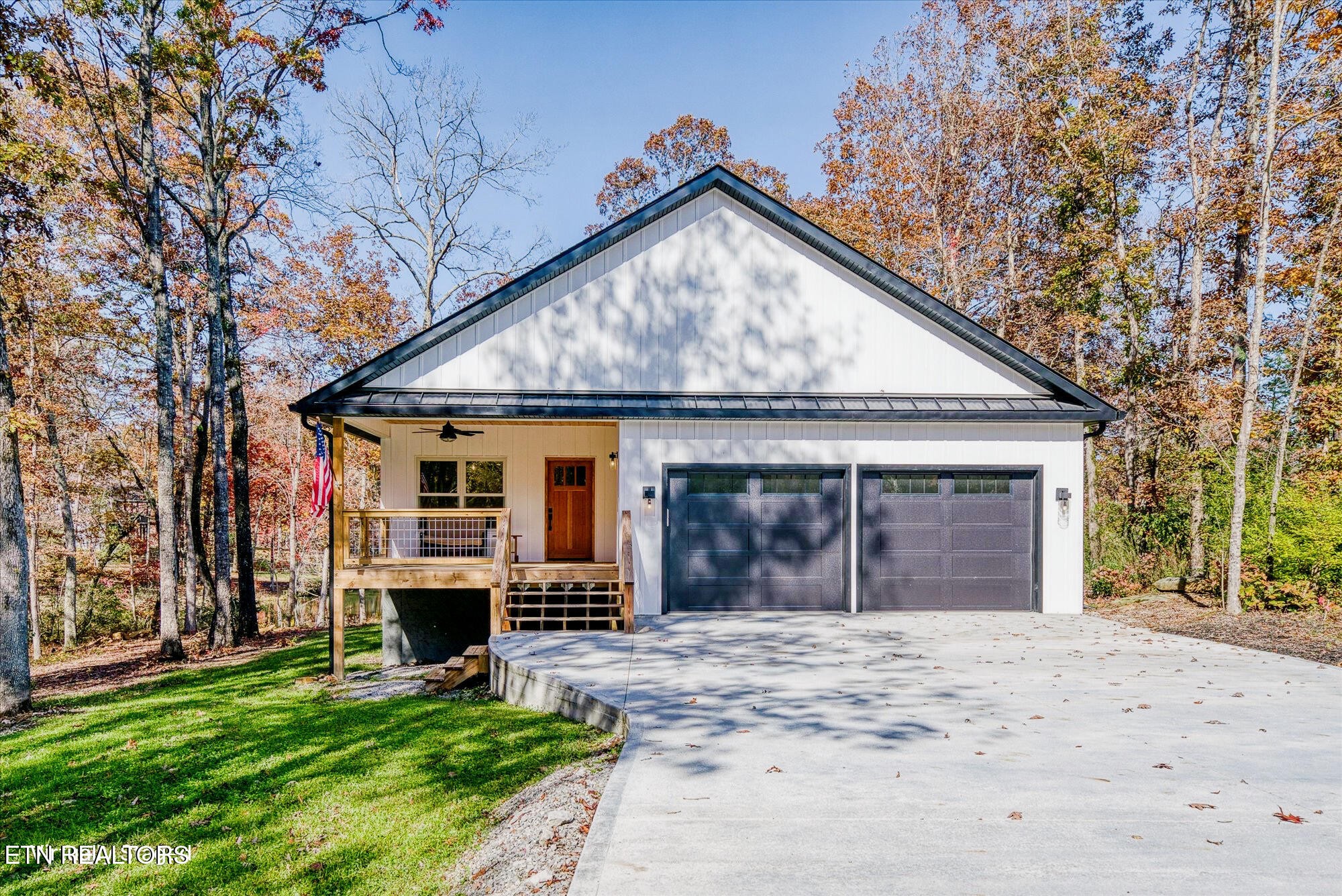565 Grassland Road Crossville, TN 38572 - Photo 1 of 53 a view of a house with a big yard and large tree