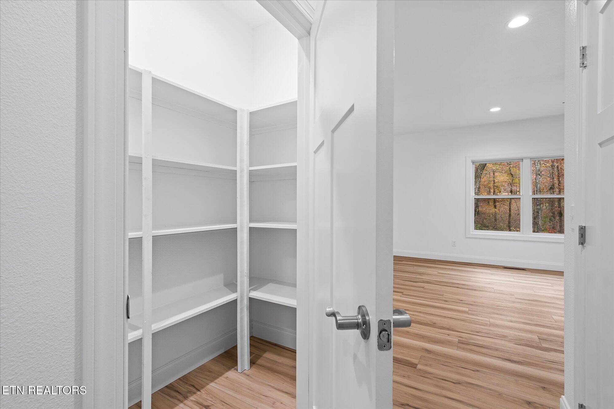 565 Grassland Road Crossville, TN 38572 - Photo 15 of 53 a view of a room with rack on the wall and a window