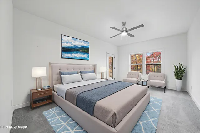 an empty room with windows and ceiling fan view