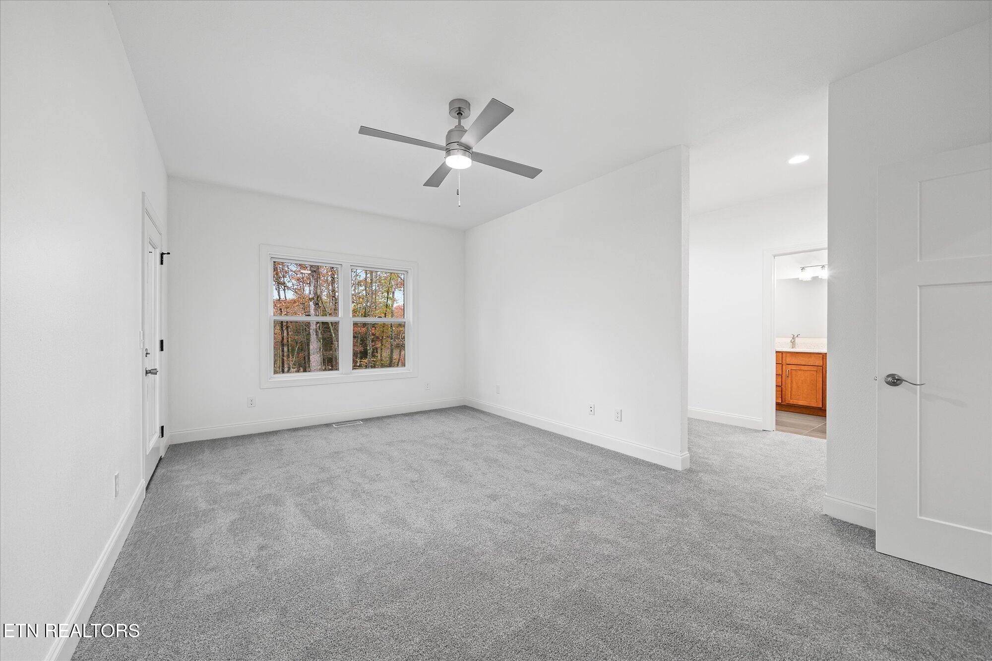 565 Grassland Road Crossville, TN 38572 - Photo 19 of 53 a view of an empty room with a window