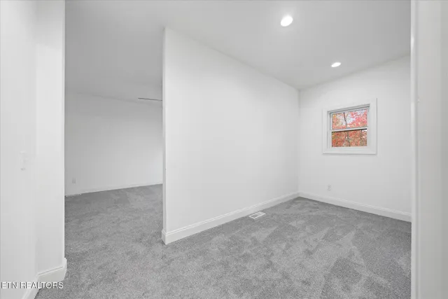 a bathroom with a double vanity sink mirror and toilet
