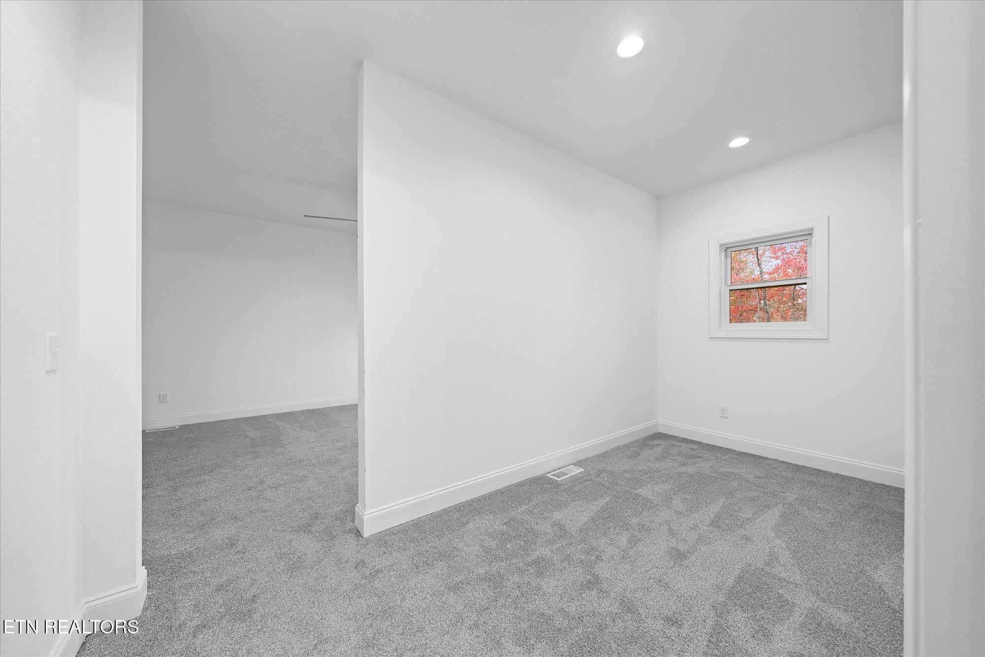 565 Grassland Road Crossville, TN 38572 - Photo 21 of 53 an empty room with a hallway