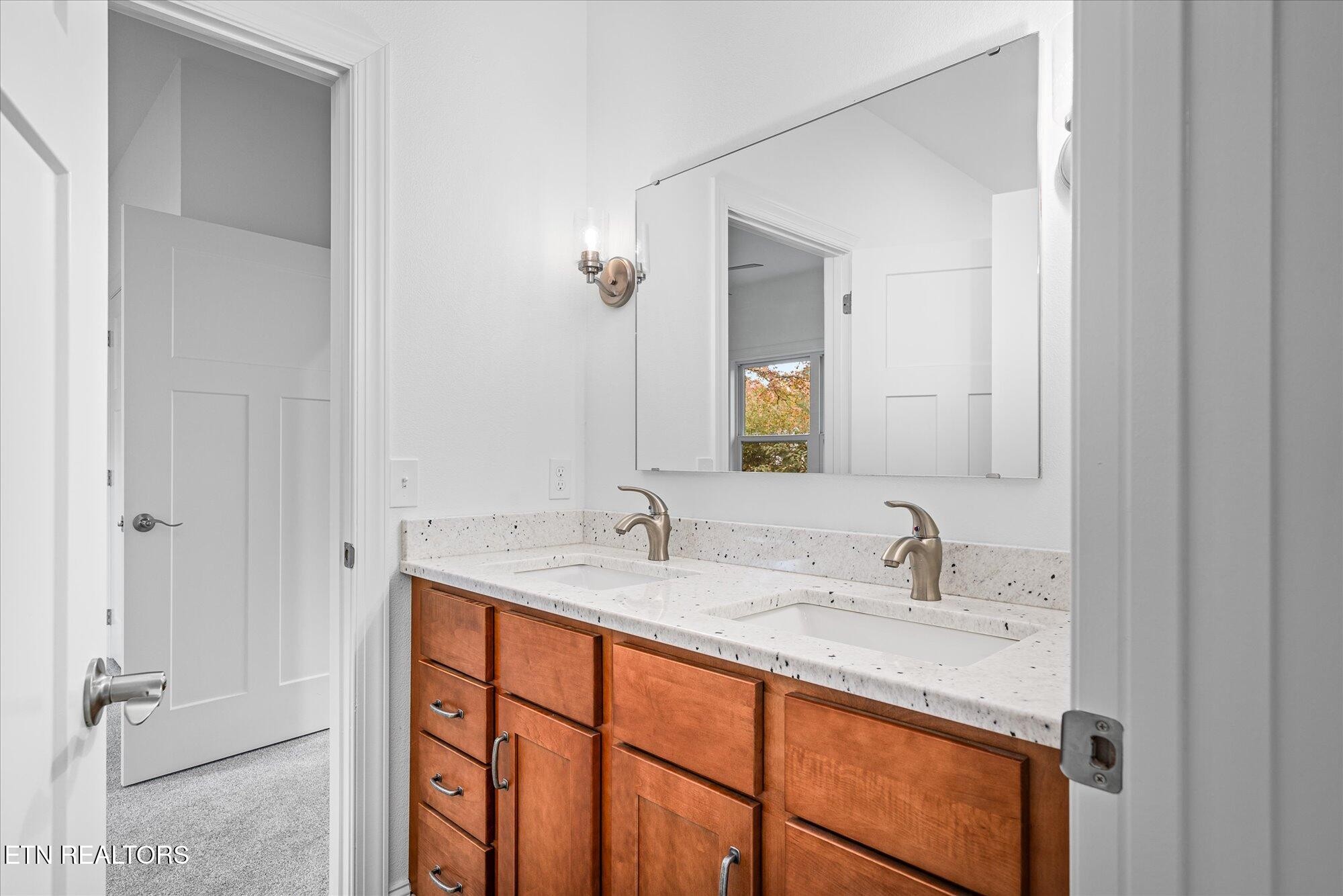 565 Grassland Road Crossville, TN 38572 - Photo 28 of 53 a bathroom with a sink and a mirror