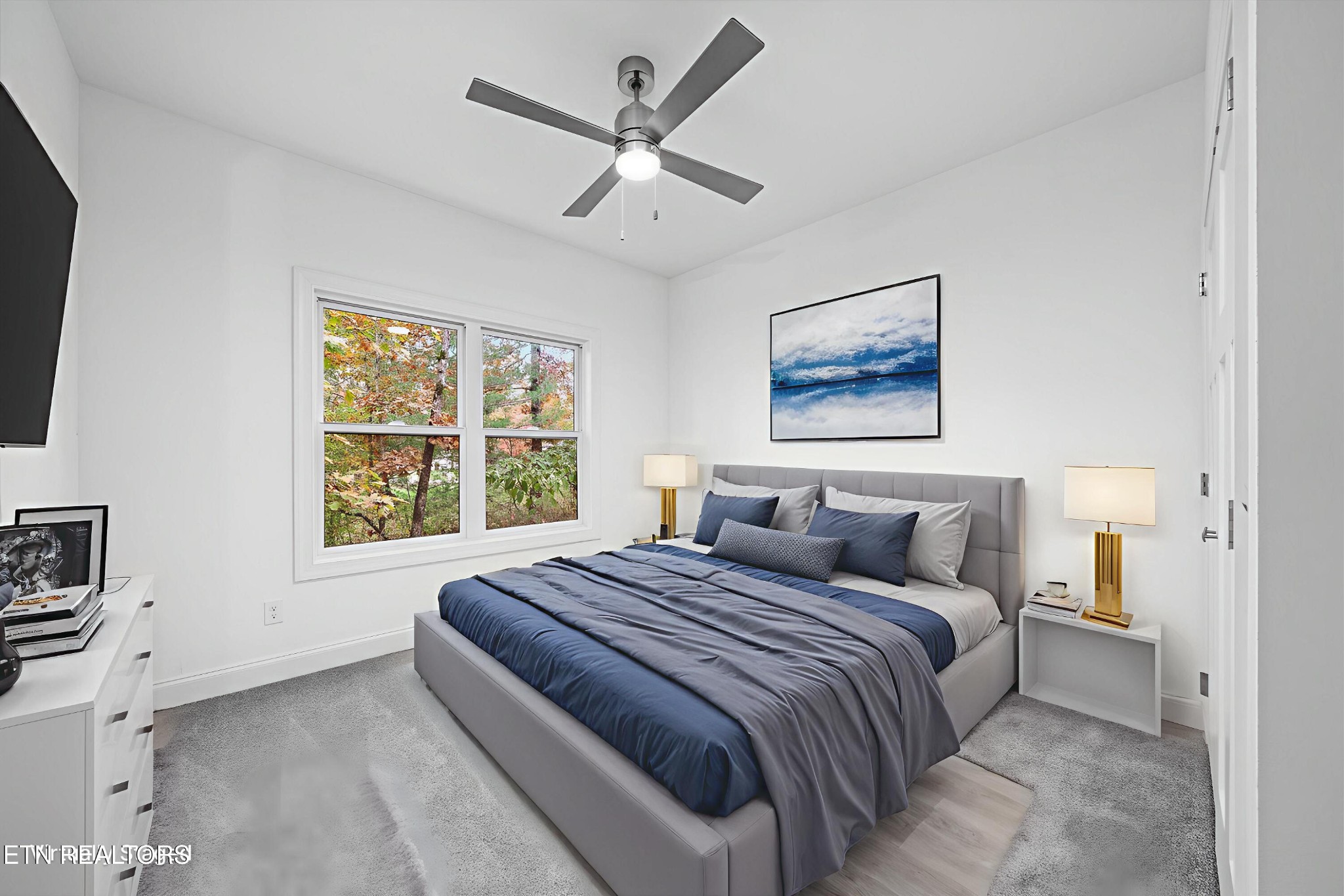 565 Grassland Road Crossville, TN 38572 - Photo 30 of 53 a bedroom with a large bed and a window