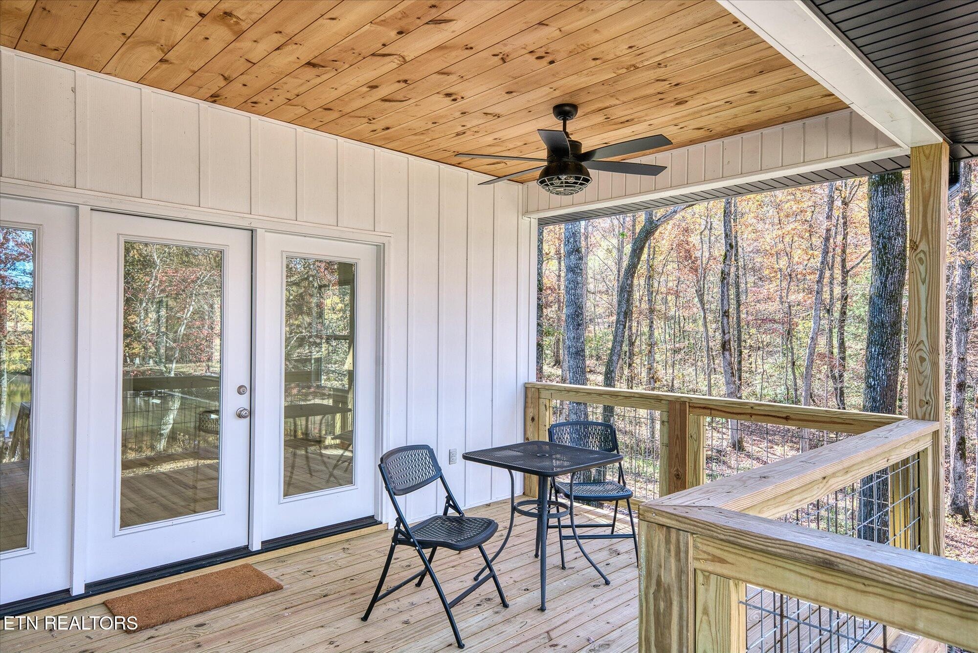 565 Grassland Road Crossville, TN 38572 - Photo 36 of 53 a view of a dining room with furniture window and outside view