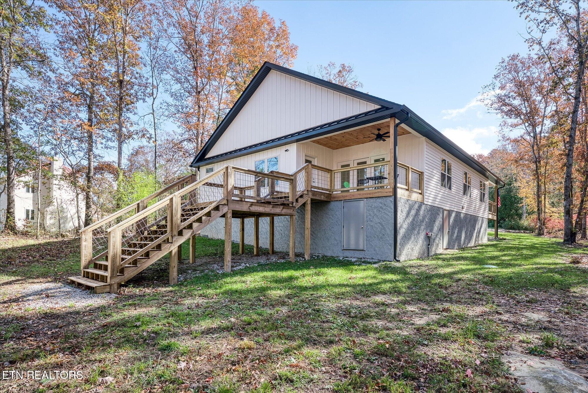 565 Grassland Road Crossville, TN 38572 - Photo 41 of 53 a view of a house with a yard