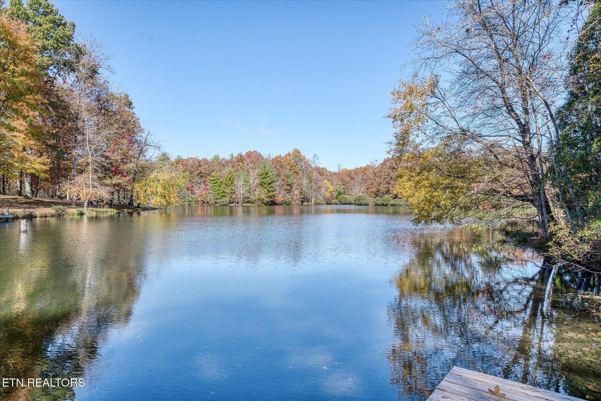 565 Grassland Road Crossville, TN 38572 - Photo 45 of 53 a view of a lake with outdoor space