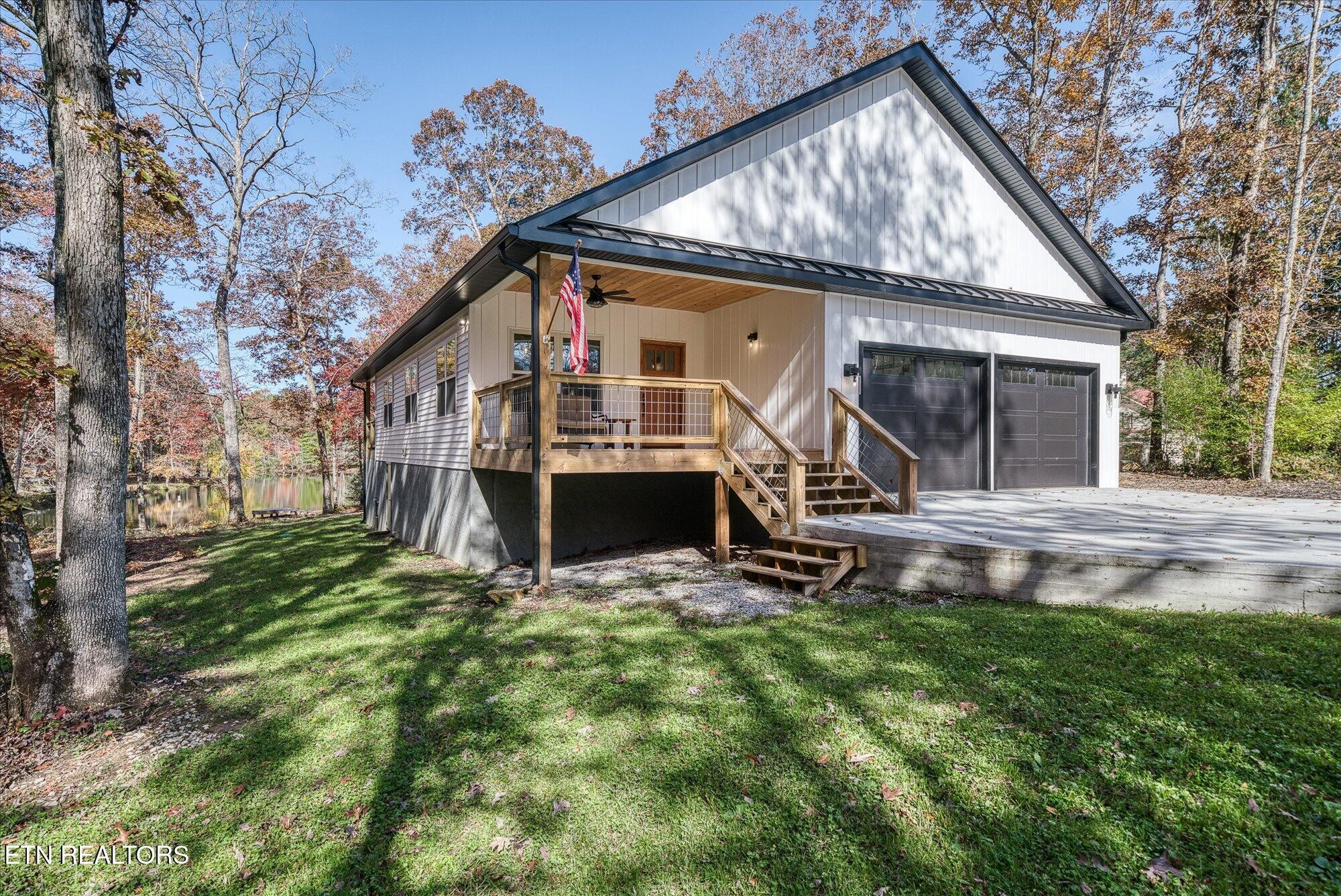 565 Grassland Road Crossville, TN 38572 - Photo 47 of 53 a view of a house with backyard