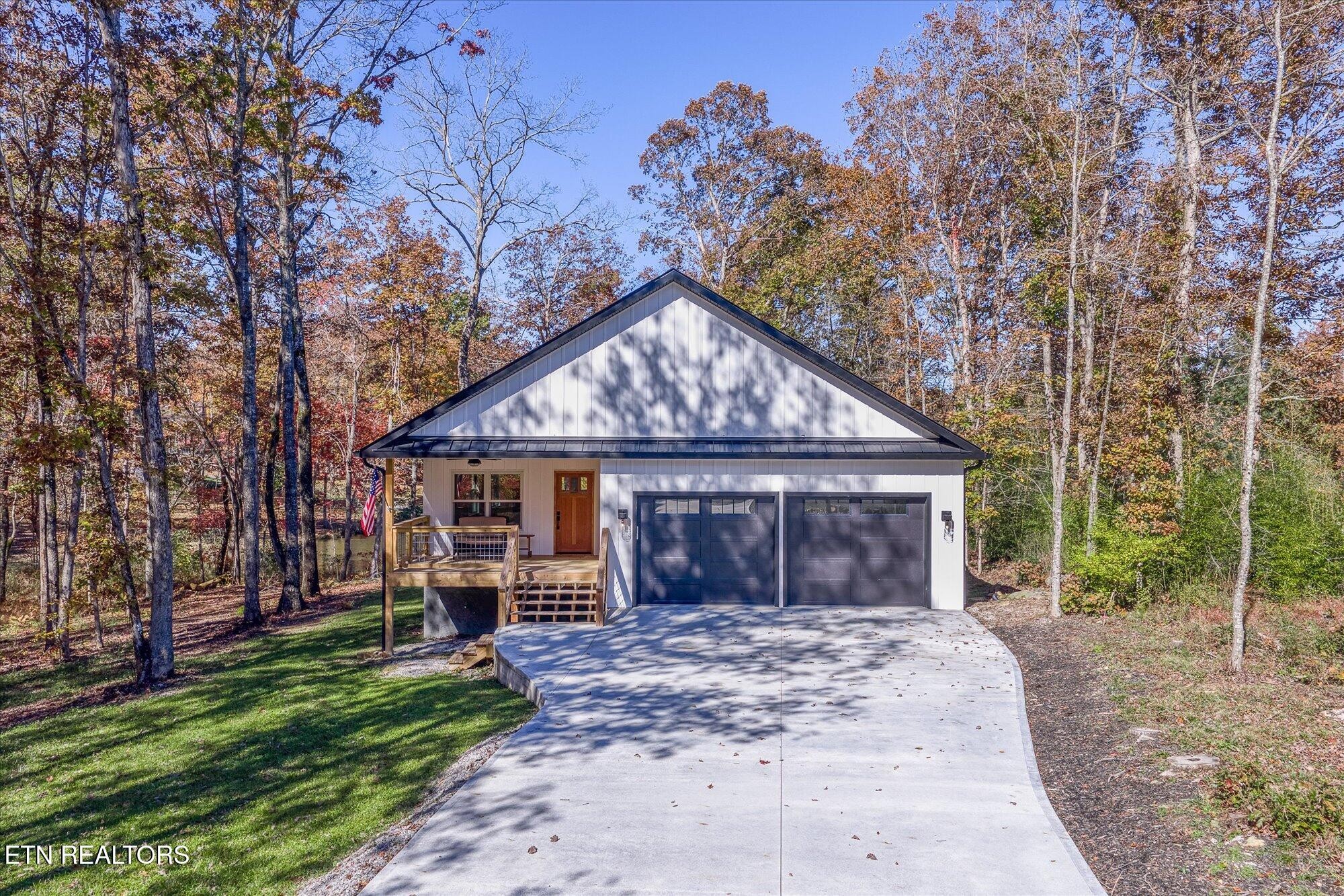 565 Grassland Road Crossville, TN 38572 - Photo 49 of 53 a front view of a house with garden