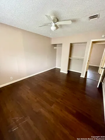 a view of backyard with wooden deck and outdoor seating