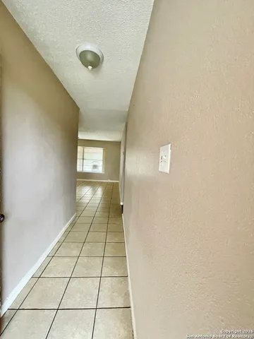 an outdoor view of house with backyard