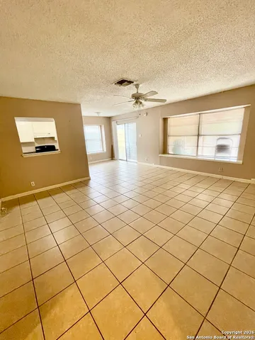 a view of a livingroom with natural light