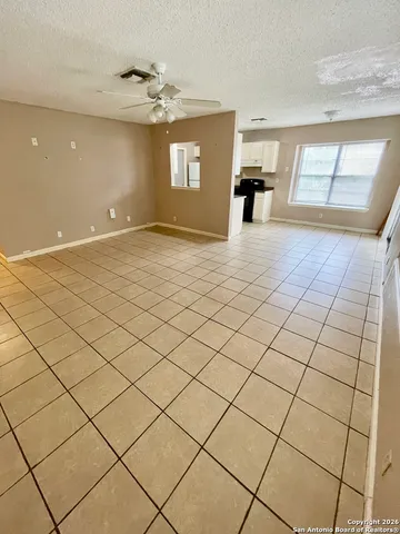 a kitchen with stainless steel appliances a refrigerator sink cabinets and a window
