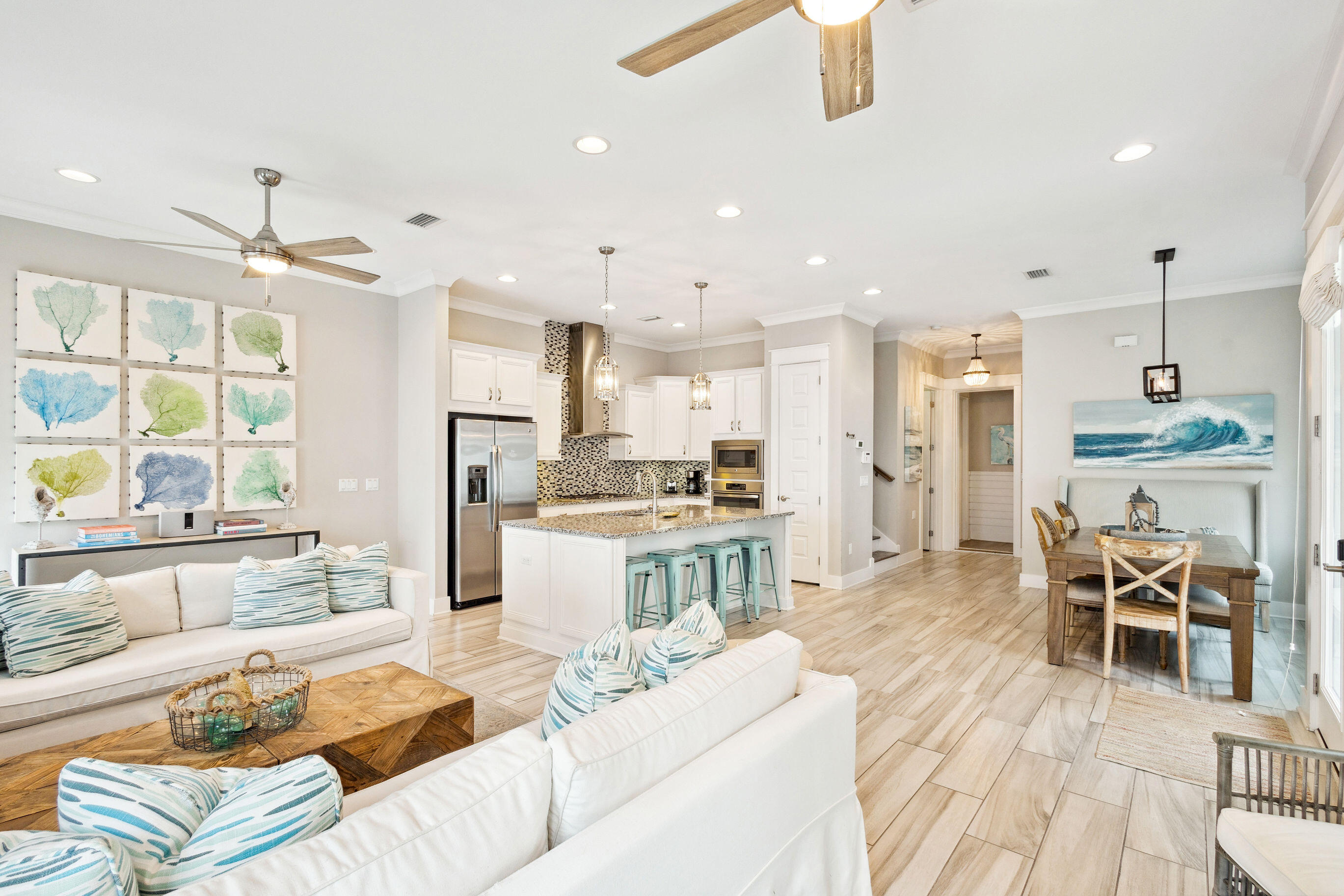 12 Milestone Dr Inlet Beach, Unit A Inlet Beach, FL 32461 - Photo 11 of 38 a living room with stainless steel appliances kitchen island granite countertop furniture and a wooden floor
