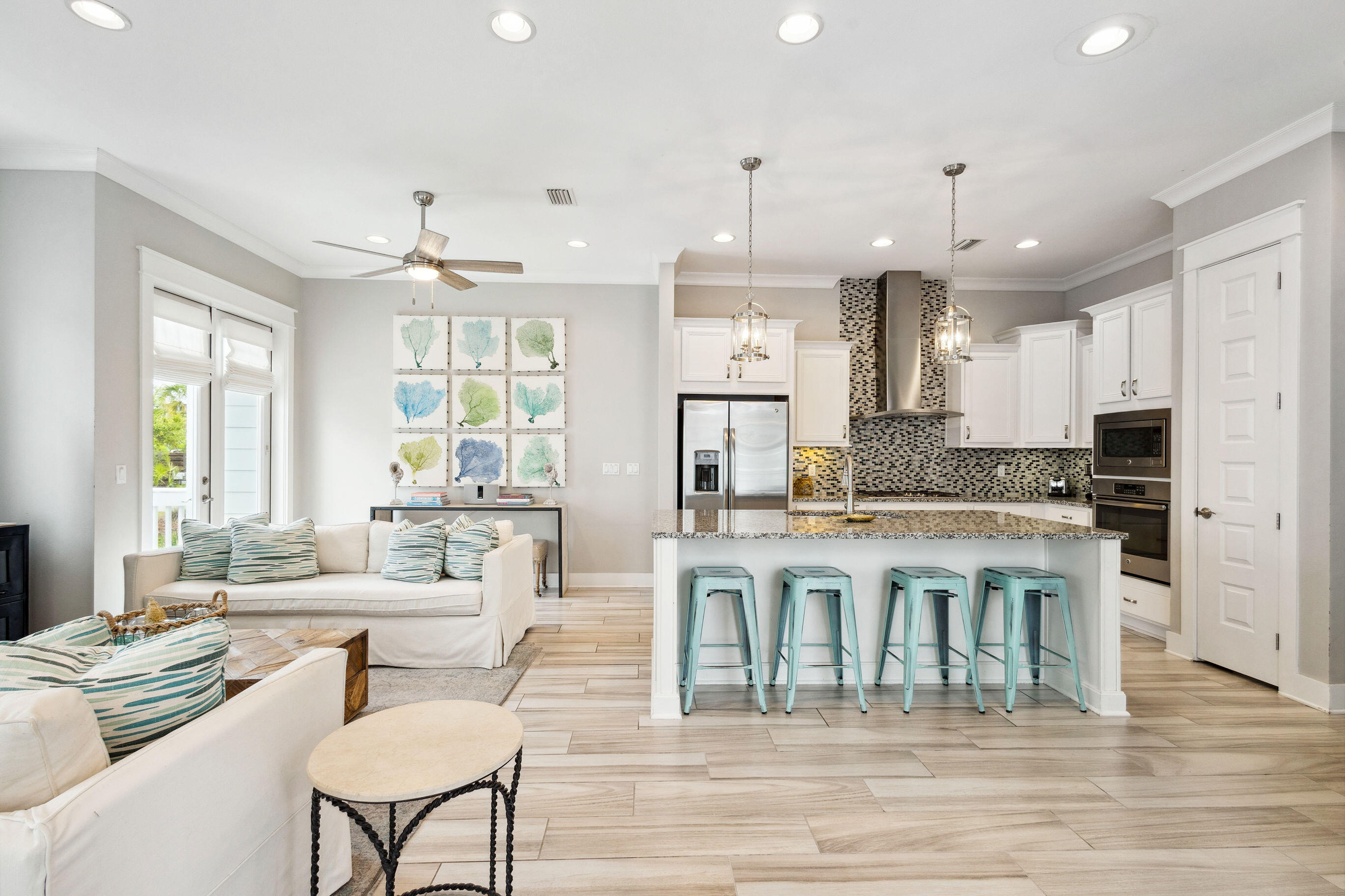 12 Milestone Dr Inlet Beach, Unit A Inlet Beach, FL 32461 - Photo 2 of 38 a large kitchen with a table and chairs