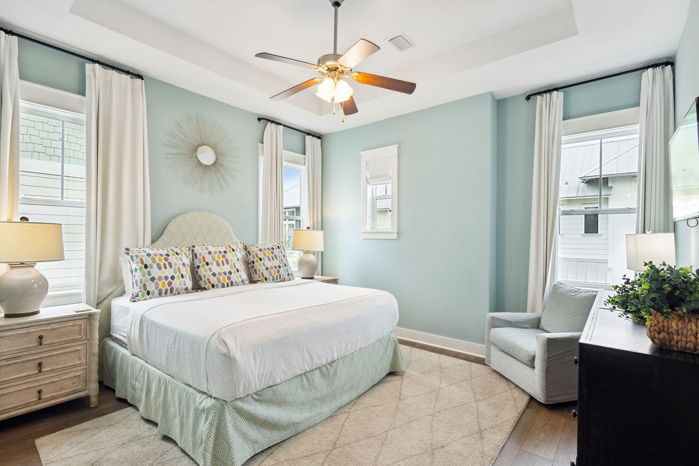 12 Milestone Dr Inlet Beach, Unit A Inlet Beach, FL 32461 - Photo 22 of 38 a bedroom with a bed and a chandelier