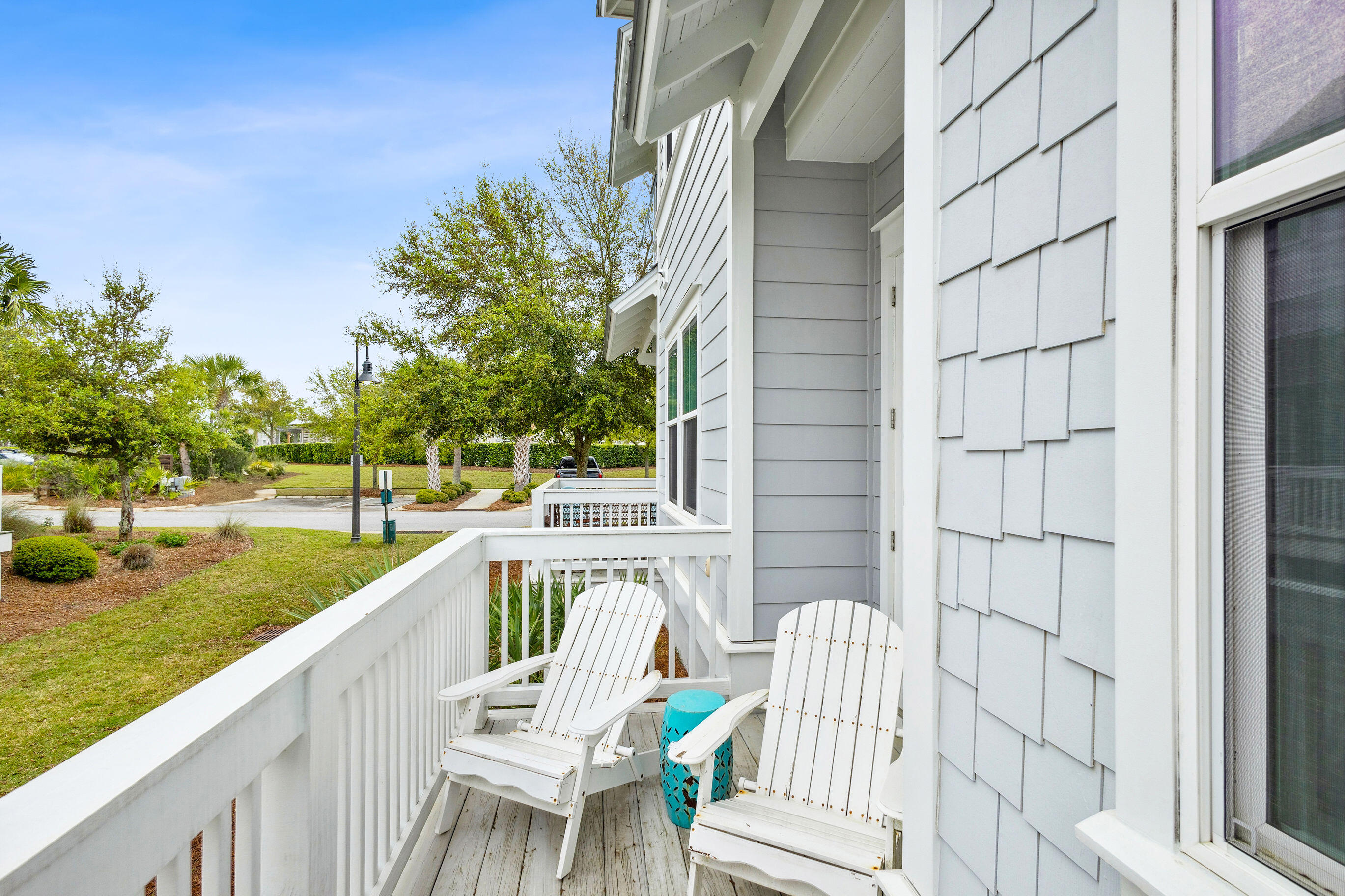 12 Milestone Dr Inlet Beach, Unit A Inlet Beach, FL 32461 - Photo 24 of 38 a view of a chair and tables in the balcony