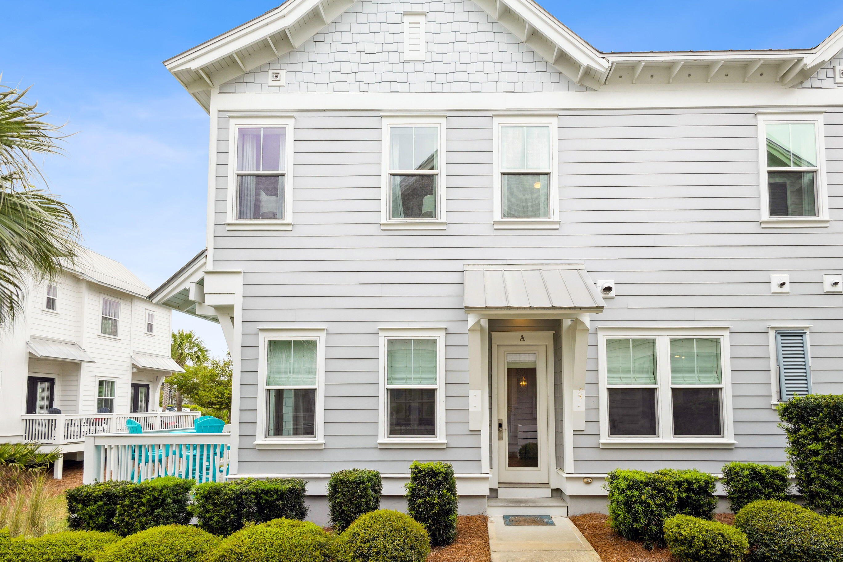 12 Milestone Dr Inlet Beach, Unit A Inlet Beach, FL 32461 - Photo 25 of 38 a front view of a residential houses with yard