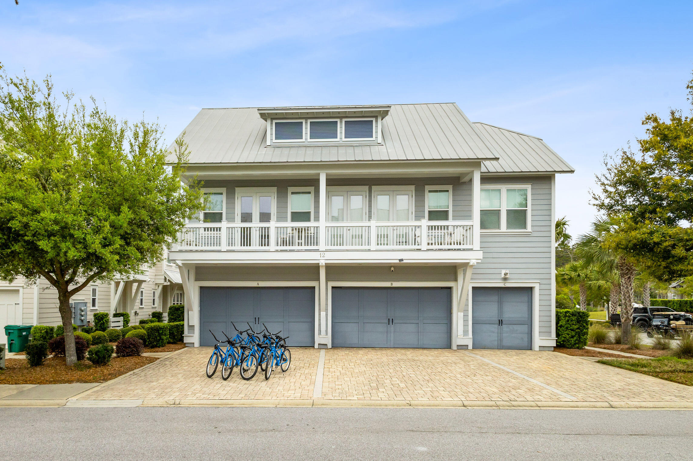 12 Milestone Dr Inlet Beach, Unit A Inlet Beach, FL 32461 - Photo 26 of 38 a front view of a house with a yard and garage