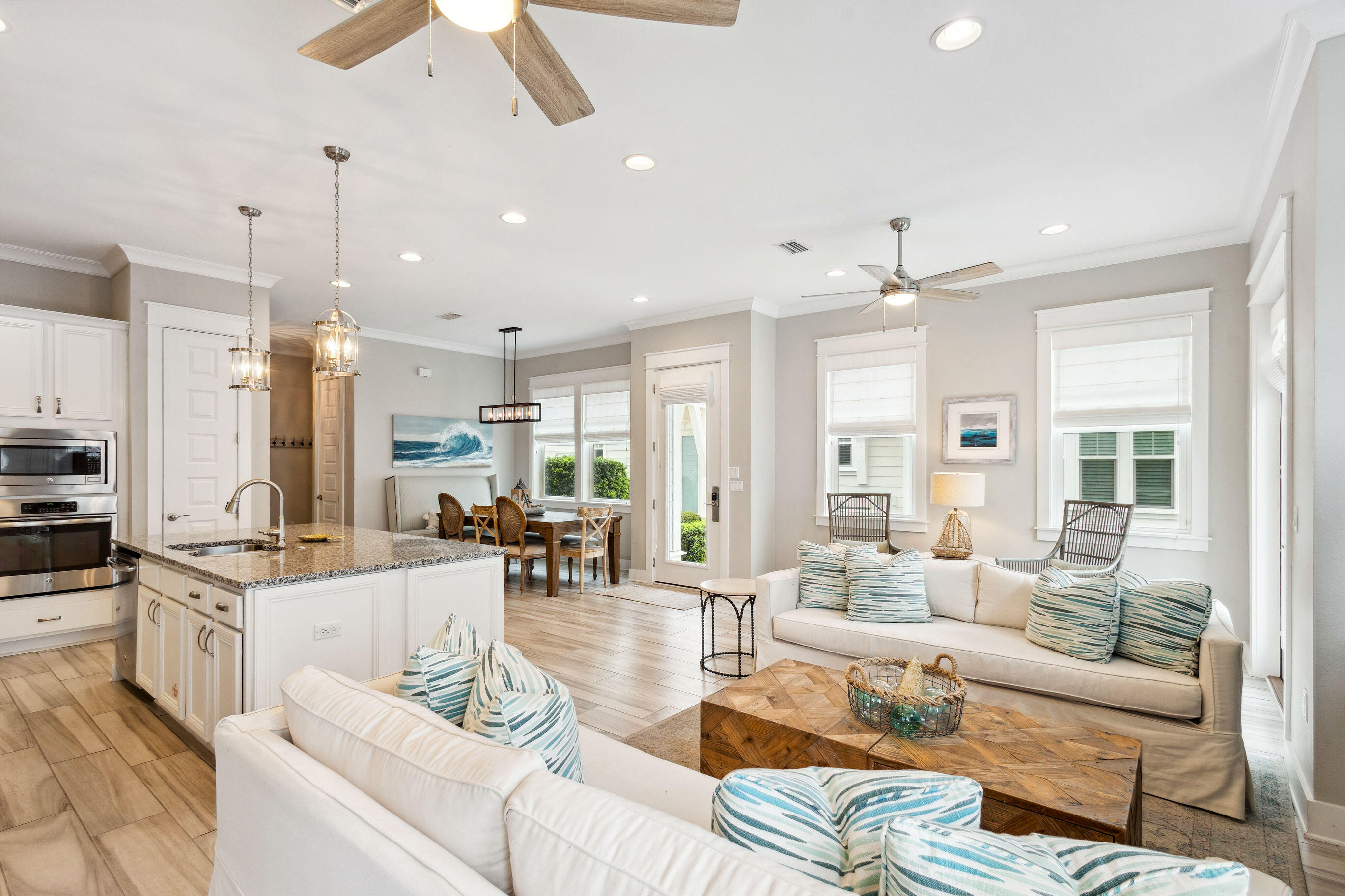 12 Milestone Dr Inlet Beach, Unit A Inlet Beach, FL 32461 - Photo 4 of 38 a living room with furniture kitchen area and a chandelier