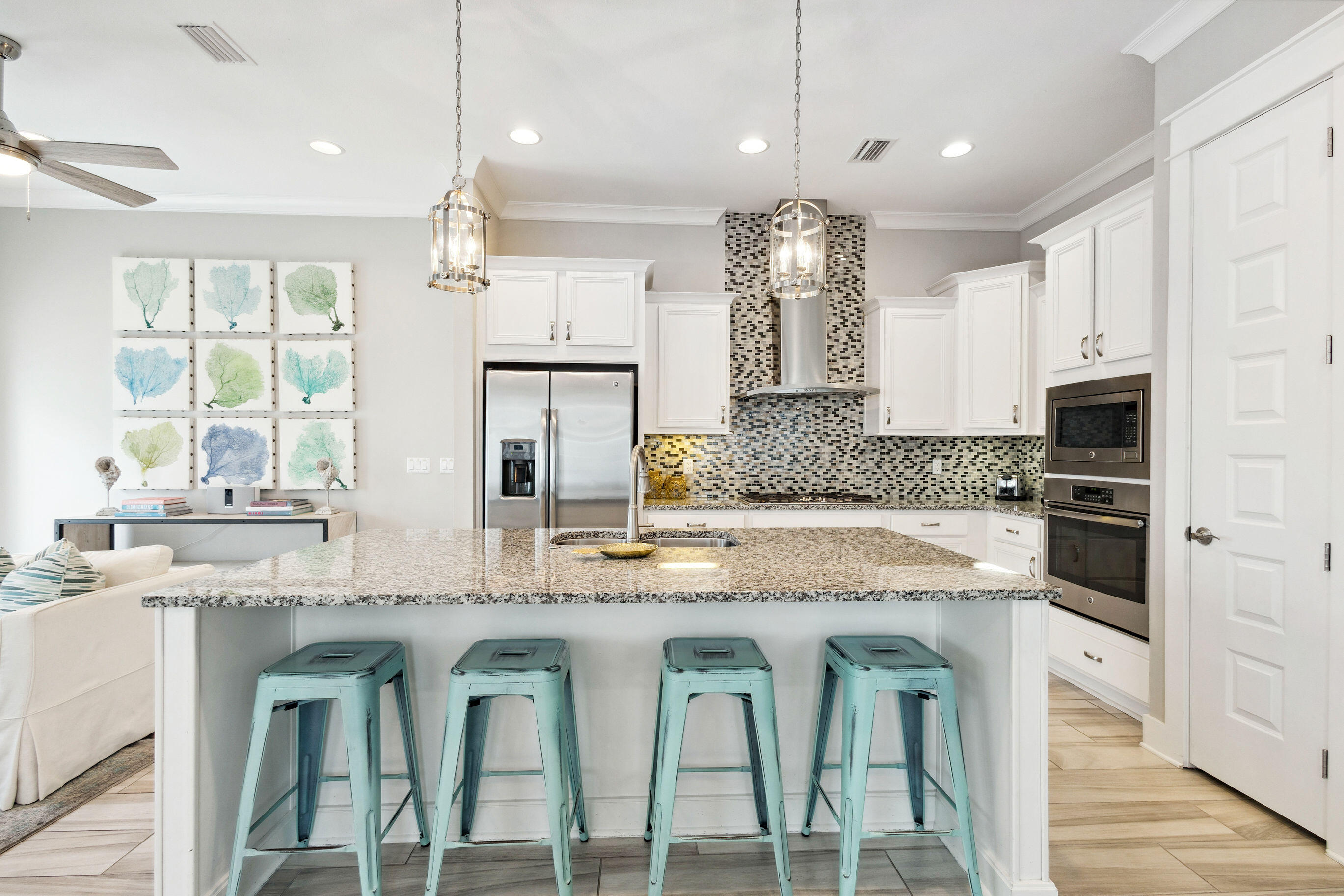 12 Milestone Dr Inlet Beach, Unit A Inlet Beach, FL 32461 - Photo 5 of 38 a kitchen with stainless steel appliances granite countertop a stove a sink and a refrigerator
