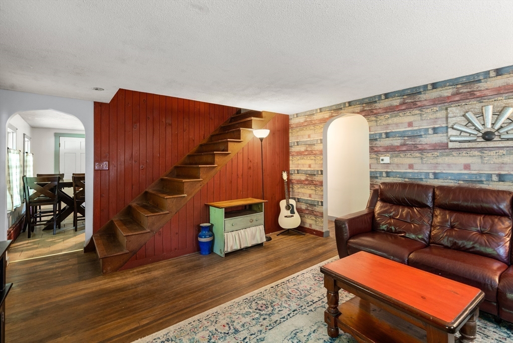 24 Webber Road Brookfield, MA 01506 - Photo 11 of 27 a living room with furniture and wooden floor