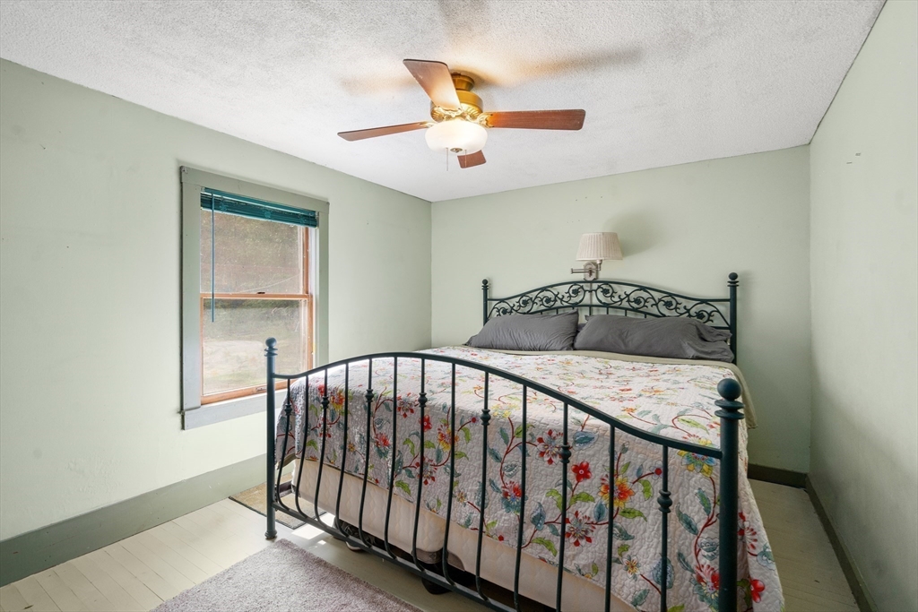 24 Webber Road Brookfield, MA 01506 - Photo 14 of 27 a bedroom with a bed and window