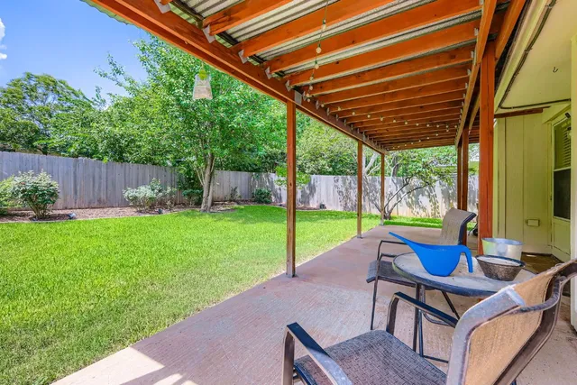 a view of yard with furniture and garden