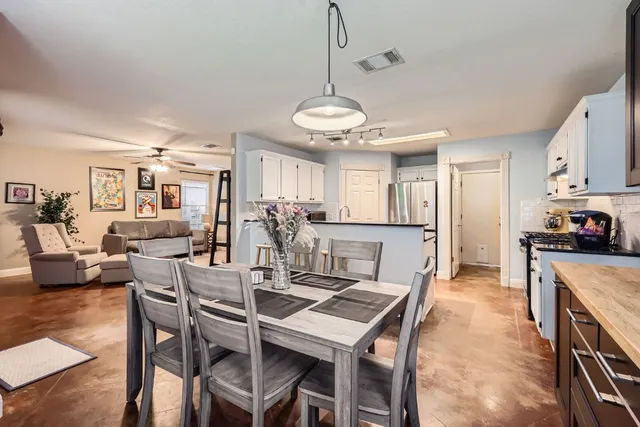 a view of a dining room with furniture
