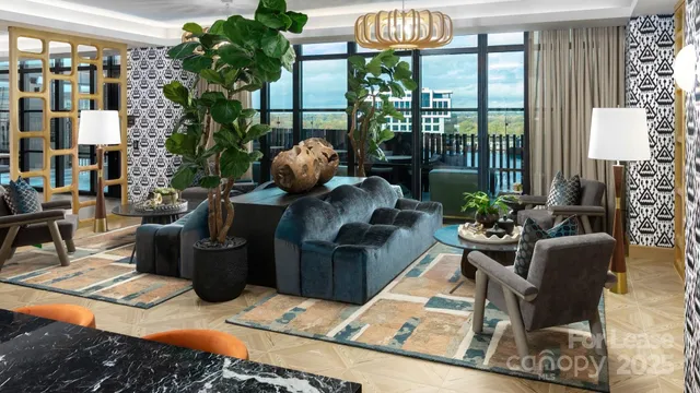 a living room with furniture floor to ceiling window and wooden floor