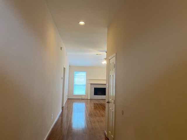 6519 Greenhouse Road Katy, TX 77449 - Photo 2 of 15 a view of a livingroom with wooden floor and a kitchen space