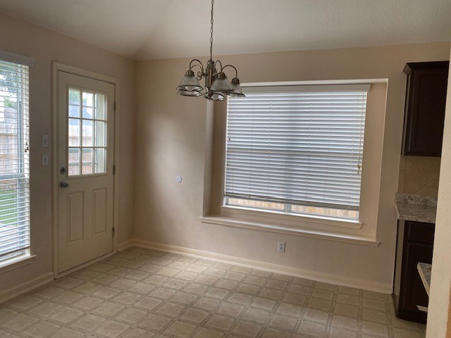 6519 Greenhouse Road Katy, TX 77449 - Photo 7 of 15 a view of an empty room with a window and fireplace