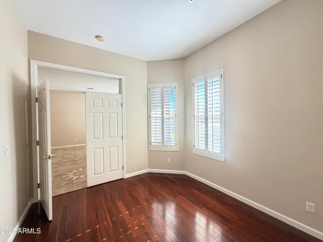 a view of empty room with ceiling fan