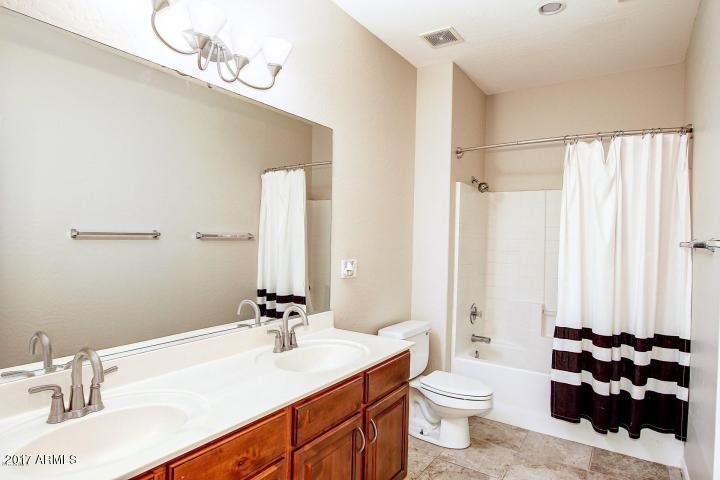16810 North 62nd Place Scottsdale, AZ 85254 - Photo 21 of 31 a bathroom with a sink vanity mirror and toilet