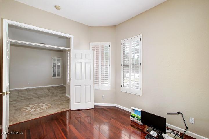 16810 North 62nd Place Scottsdale, AZ 85254 - Photo 25 of 31 a view of an empty room with wooden floor and a window