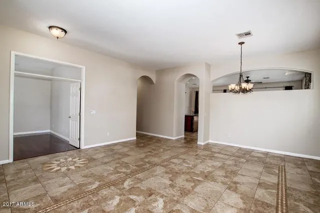 a view of a kitchen with a sink and cabinet