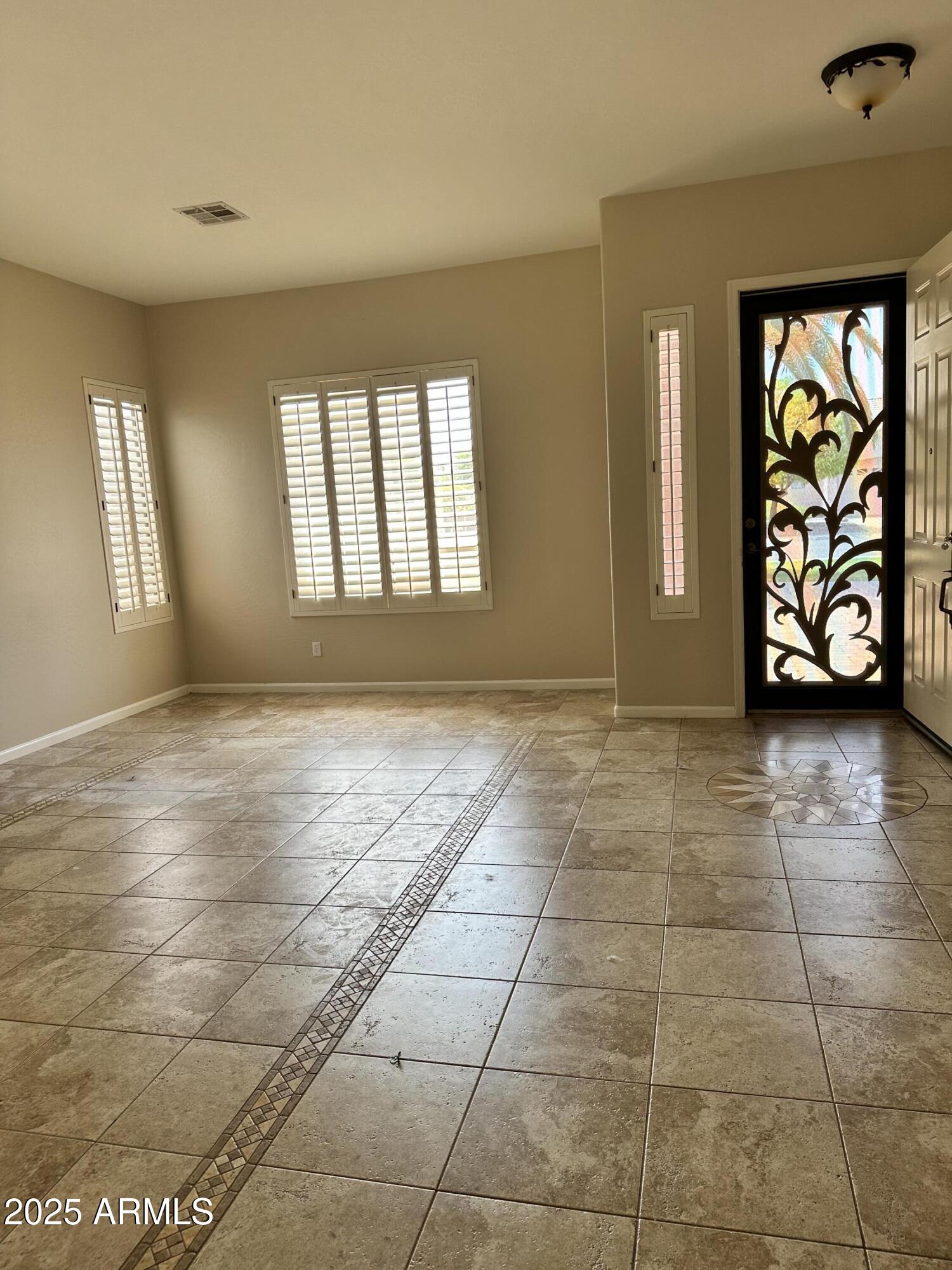 16810 North 62nd Place Scottsdale, AZ 85254 - Photo 4 of 31 a view of an empty room and window