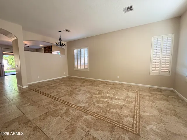 a kitchen with stainless steel appliances granite countertop a refrigerator a stove and a sink