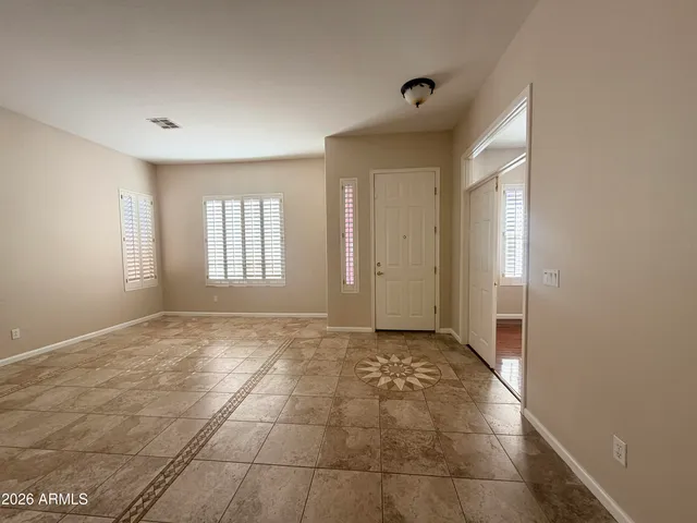 a kitchen with stainless steel appliances granite countertop a stove a sink dishwasher a refrigerator and a microwave