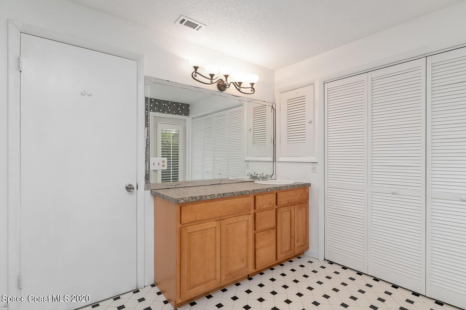 199 Sand Pine Road Indialantic, FL 32903 - Photo 23 of 30 Guest Bath w/ Laundry Closet